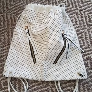 White leather drawstring backpack with cutouts